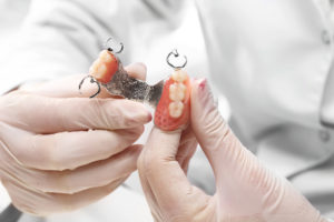 What to Understand About Implants and Dentures