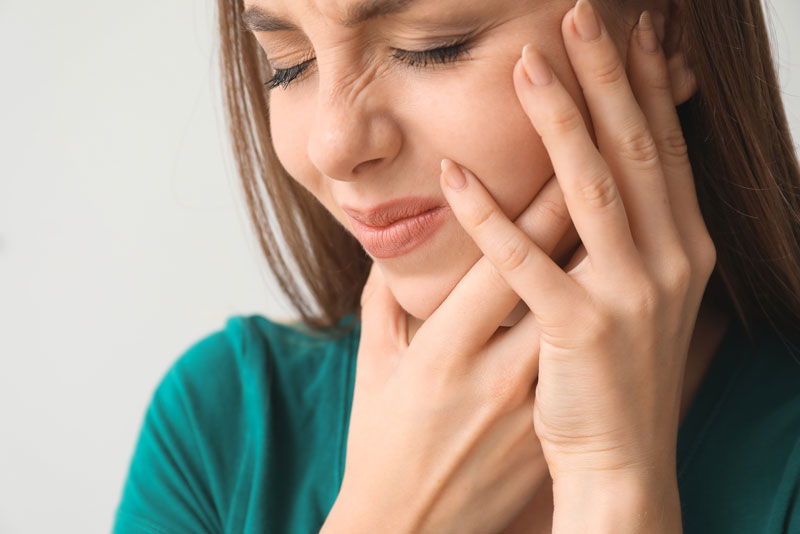 Dental Patient Suffering From A Failed Dental Implant