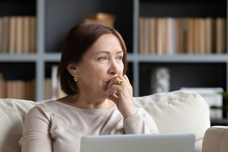 a women deciding on dental implants or dentures