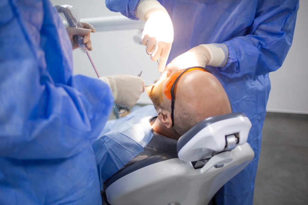 A wisdom tooth extraction surgery in progress in a dental hospital. Dental check up.
